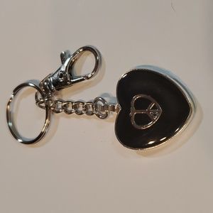 Keychain made of resin with heart charm inside. Handcrafted
